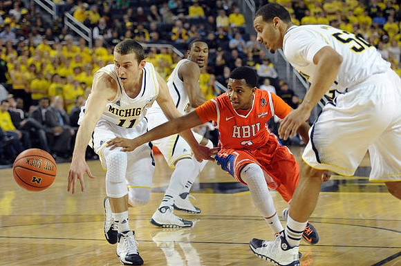 Nik Stauskas (11), Zak Irvin (21), and Jordan Morgan (52)