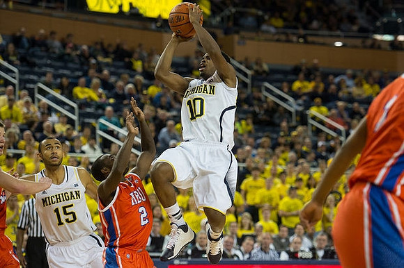 Jon Horford (15) and Derrick Walton Jr. (10)
