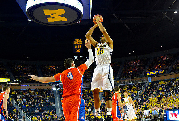 Jon Horford (15) and Spike Albrecht (2)