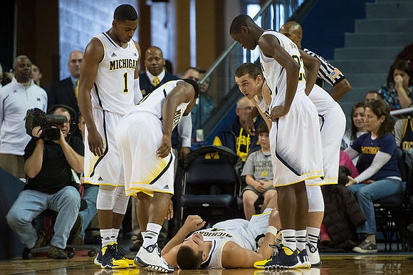 Glenn Robinson III (1), Derrick Walton Jr. (10), Mitch McGary (4), Nik Stauskas (11), and Caris LeVert (23)