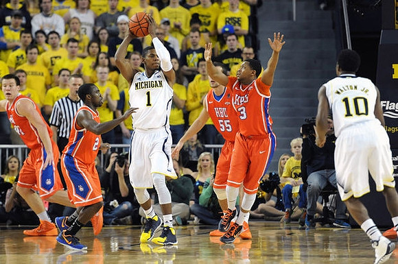 Glenn Robinson III (1) and Derrick Walton Jr. (10)