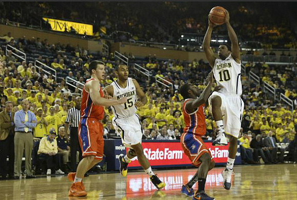 Jon Horford (15) and Derrick Walton Jr. (10)