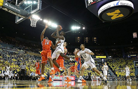 Caris LeVert (23), Jordan Morgan (52), Spike Albrecht (2), and Mitch McGary (4)
