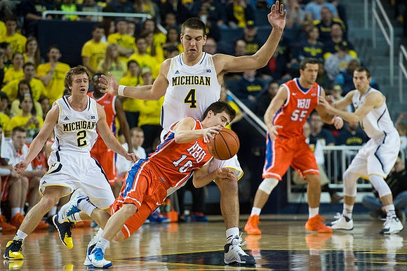 Spike Albrecht (2), Mitch McGary (4), and Nik Stauskas (11)