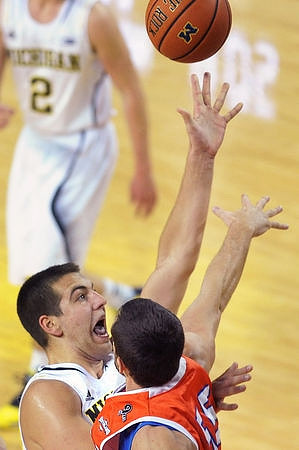 Mitch McGary (4) and Spike Albrecht (2)