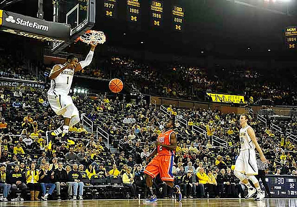 Glenn Robinson III (1) and Nik Stauskas (11)