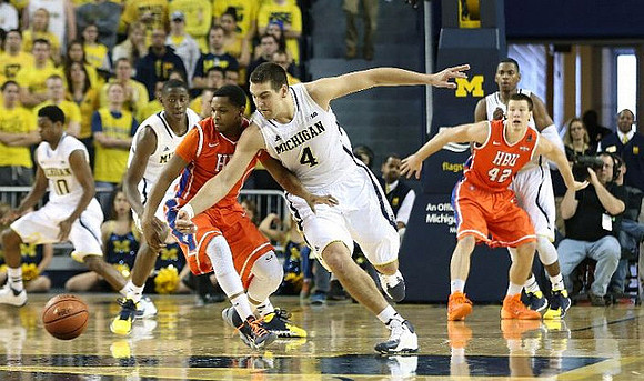 Derrick Walton Jr. (10), Caris LeVert (23), Mitch McGary (4), and Glenn Robinson III (1)