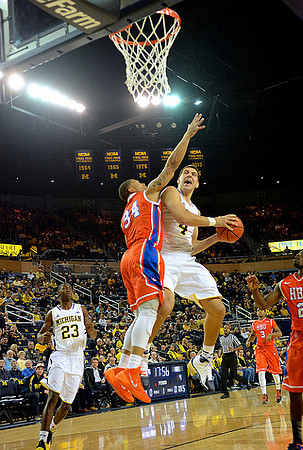 Caris LeVert (23) and Mitch McGary (4)
