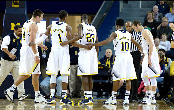 Mitch McGary (4), Glenn Robinson III (1), Caris LeVert (23), Derrick Walton Jr. (10), and Nik Stauskas (11)