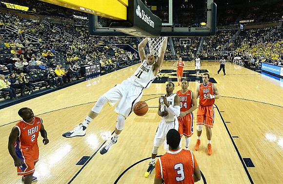 Nik Stauskas (11), Glenn Robinson III (1), and Derrick Walton Jr. (10)