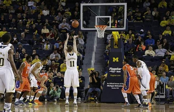 Derrick Walton Jr. (10), Jon Horford (15), Nik Stauskas (11), and Glenn Robinson III (1)