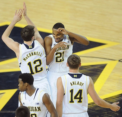Derrick Walton Jr. (10), Cole McConnell (12), Zak Irvin (21), and Brad Anlauf (14)