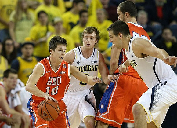 Spike Albrecht (2) and Mitch McGary (4)