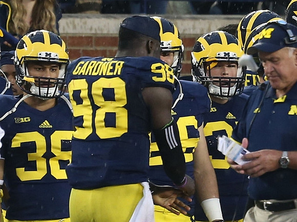 Francois Montbrun (38), Devin Gardner (98), and Greg Mattison