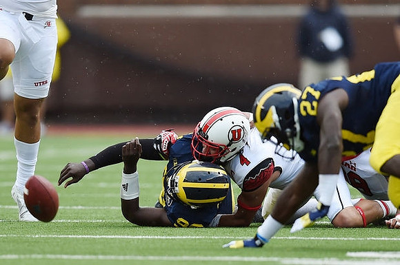 Devin Gardner (98) and Derrick Green (27)