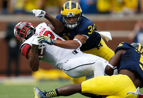 Jeremy Clark (34) and Jabrill Peppers (5)