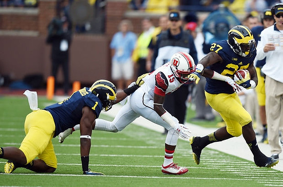 Devin Funchess (1) and Derrick Green (27)
