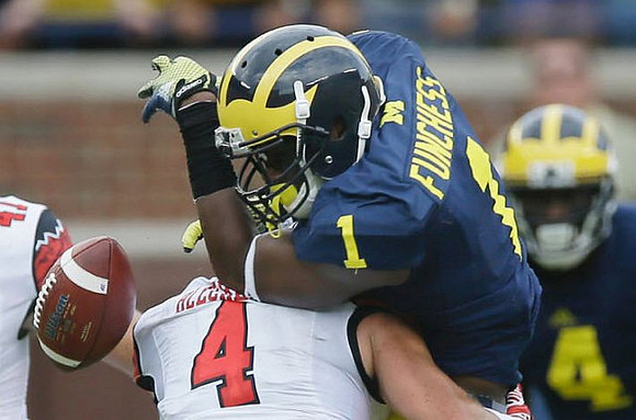Devin Funchess (1) and De'Veon Smith (4)