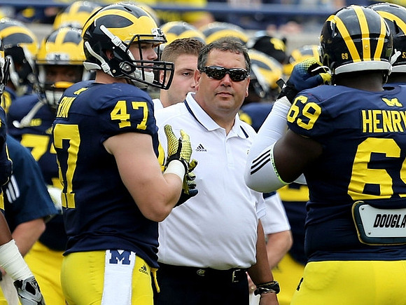 Jake Ryan (47), Brady Hoke, and Willie Henry (69)