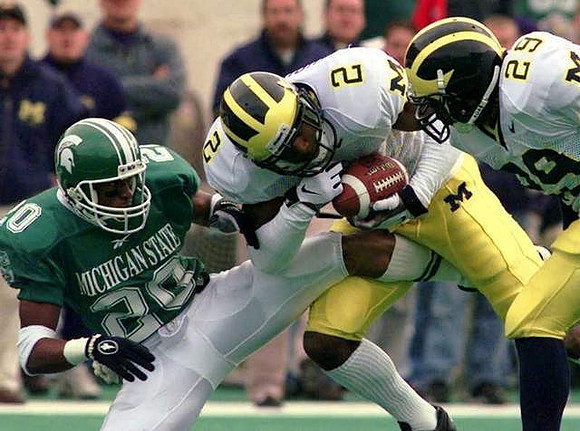 Charles Woodson (2) and Marcus Ray (29)
