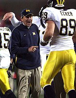 Lloyd Carr, Tyler Ecker, and Steve Breaston