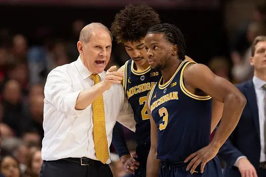 John Beilein, Jordan Poole (2), and Zavier Simpson (3)