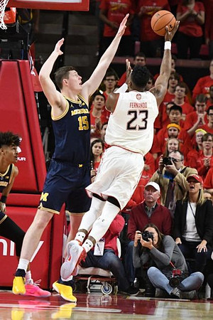 Jon Teske (15) and Jordan Poole (2)