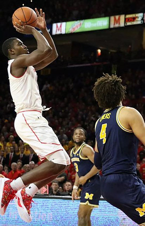 Zavier Simpson (3) and Isaiah Livers (4)