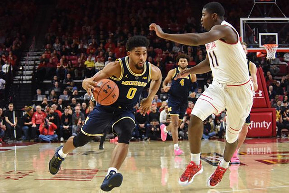 David DeJulius (0) and Isaiah Livers (4)