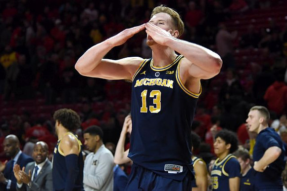 Ignas Brazdeikis (13) and Michigan Team