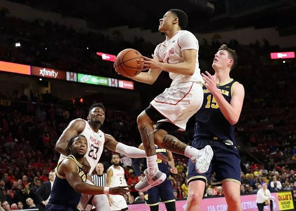 Zavier Simpson (3) and Jon Teske (15)