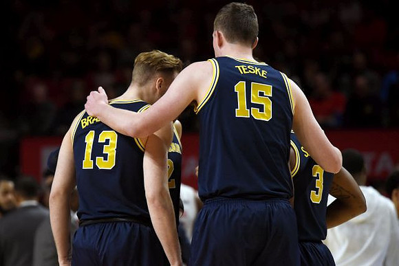Ignas Brazdeikis (13), Jon Teske (15), and Zavier Simpson (3)
