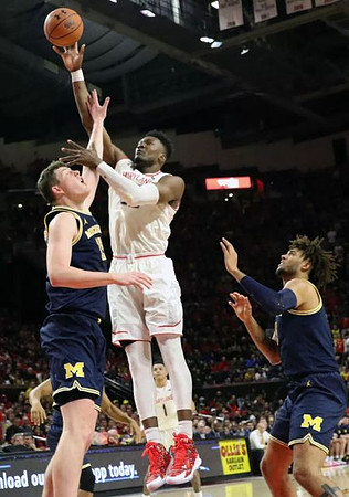 Jon Teske (15) and Isaiah Livers (4)