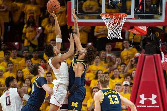 Colin Castleton (11), Isaiah Livers (4), and Ignas Brazdeikis (13)