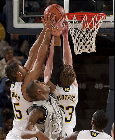 Jon Horford (15) and Evan Smotrycz (23)