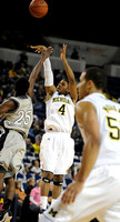 Darius Morris (4) and Jordan Morgan (52)