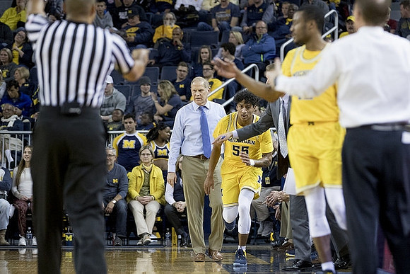 John Beilein, Eli Brooks (55), and Muhammad-Ali Abdur-Rahkman (12)