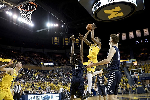 Jon Teske (15) and Charles Matthews (1)