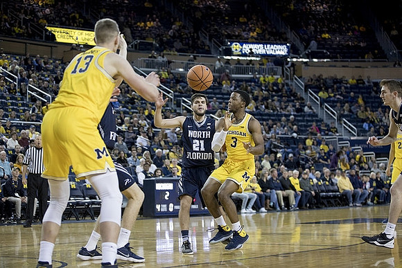 Zavier Simpson (3) and Moritz Wagner (13)