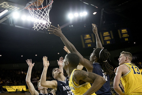 Zavier Simpson (3) and Moritz Wagner (13)