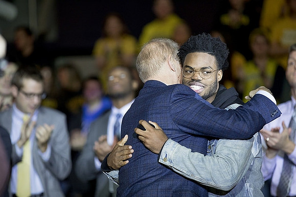 John Beilein and Derrick Walton Jr.