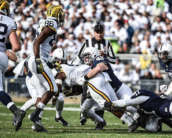 Mason Cole (52), Jehu Chesson (86), and De'Veon Smith (4)