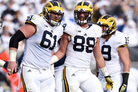 Graham Glasgow (61), Jake Butt (88), and Henry Poggi (19)