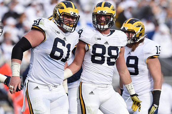 Graham Glasgow (61), Jake Butt (88), and Henry Poggi (19)