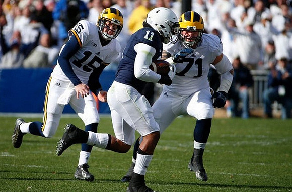 Jake Rudock (15) and Ben Braden (71)