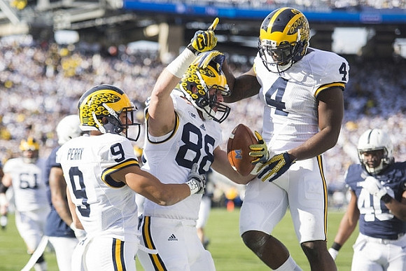 Graham Glasgow (61), Grant Perry (9), Jake Butt (88), and De'Veon Smith (4)