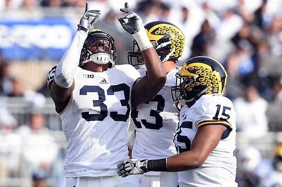Taco Charlton (33), Chris Wormley (43), and James Ross (15)