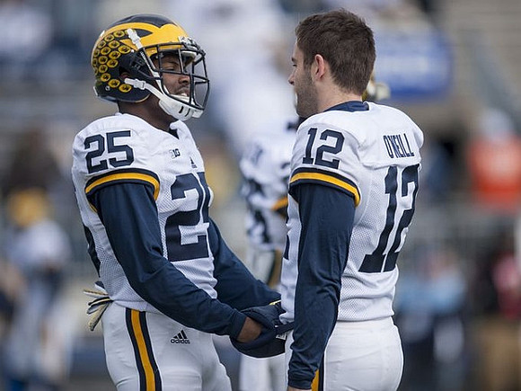 Dymonte Thomas (25) and Blake O'Neill (12)