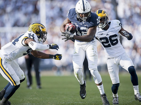 Delano Hill (44) and Jourdan Lewis (26)