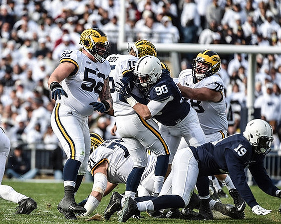 Mason Cole (52), Ben Braden (71), Jake Rudock (15), and Erik Magnuson (78)